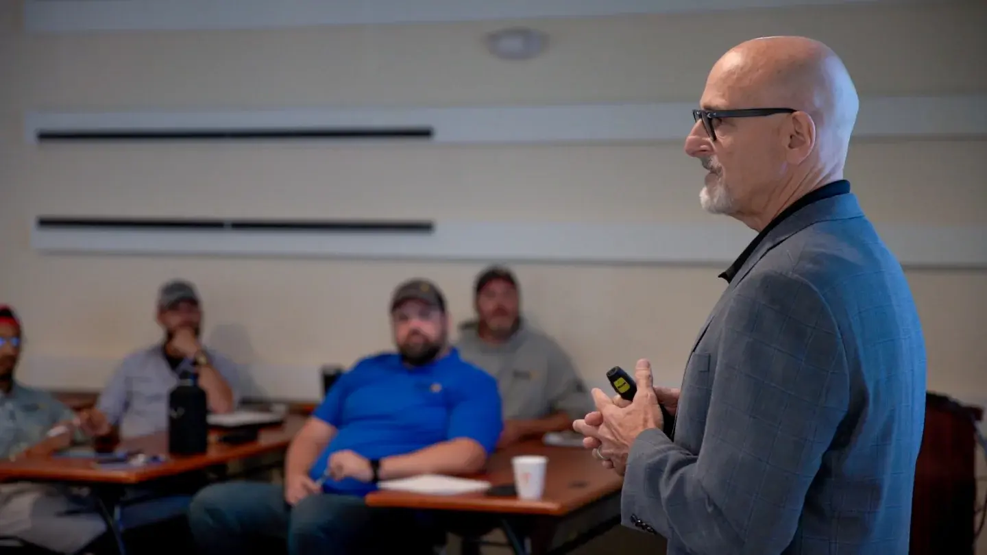 An Endless Customers coach presenting a prioritized marketing plan to a client team
