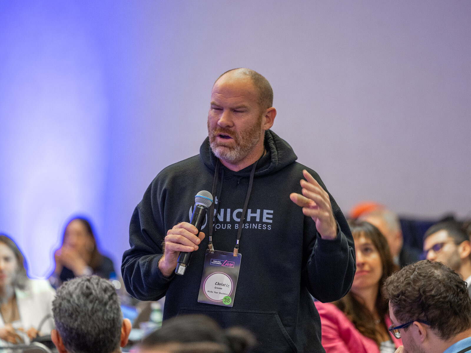 An attendee asking a question on the mic